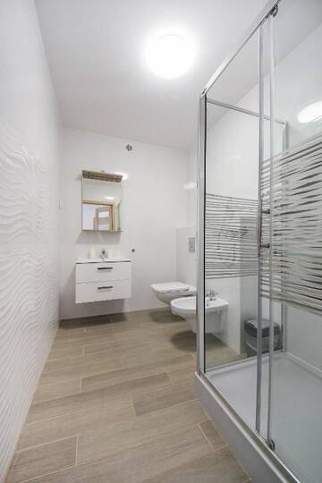 Фото номера Четырехместный номер с балконом Курортные отели Family-Holiday Spa&amp;Resort г. Дзивнувек 6