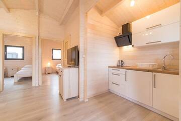Фото номера Шале с двумя спальнями Курортные отели Family-Holiday Spa&amp;Resort г. Дзивнувек 6