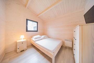 Фото номера Шале с двумя спальнями Курортные отели Family-Holiday Spa&amp;Resort г. Дзивнувек 8