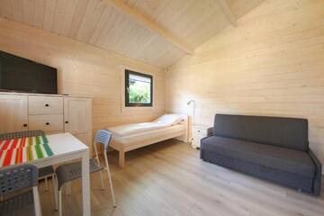 Фото номера Шале с одной спальней Курортные отели Family-Holiday Spa&amp;Resort г. Дзивнувек 2