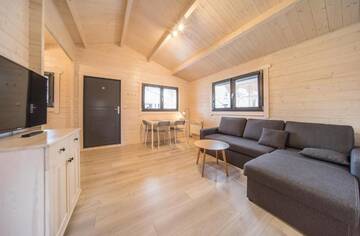 Фото номера Шале с двумя спальнями Курортные отели Family-Holiday Spa&amp;Resort г. Дзивнувек 13