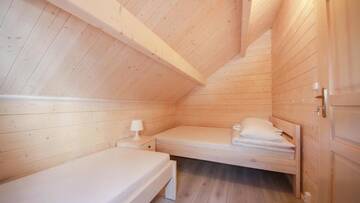 Фото номера Шале с двумя спальнями Курортные отели Family-Holiday Spa&amp;Resort г. Дзивнувек 10