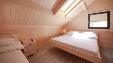 Фото номера Шале с двумя спальнями Курортные отели Family-Holiday Spa&amp;Resort г. Дзивнувек 5
