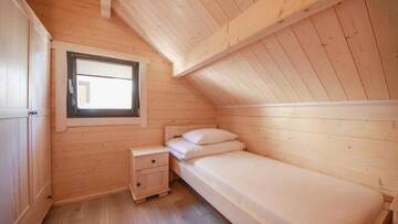 Фото номера Шале с двумя спальнями Курортные отели Family-Holiday Spa&amp;Resort г. Дзивнувек 11