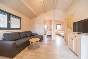 Фото номера Шале с двумя спальнями Курортные отели Family-Holiday Spa&amp;Resort г. Дзивнувек 4
